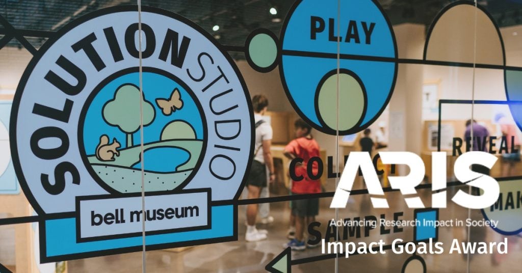 Photo of Solution Studio at the Bell Museum with a white logo for ARIS: Advancing Research Impact in Society and "Impact Goals Award" superimposed on top.