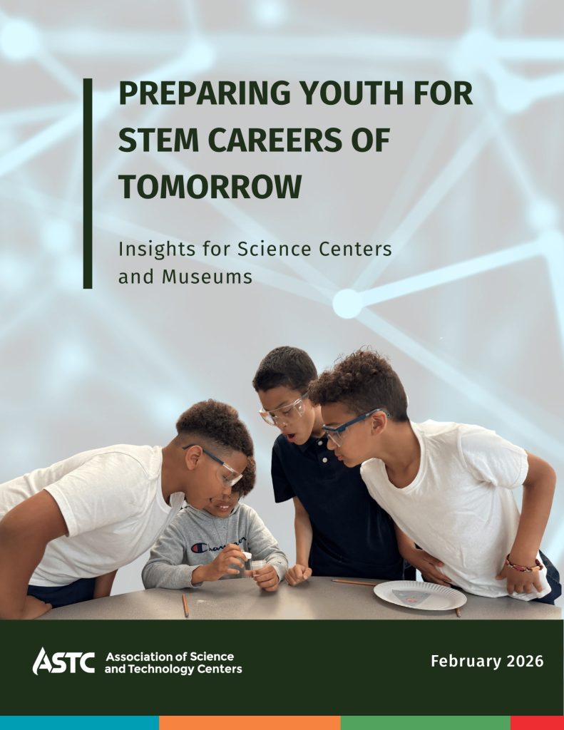 Cover image of a report titled "Preparing Youth for STEM Careers of Tomorrow" Below the text there is a photo of four boys looking with interest at the contents of a small vial.