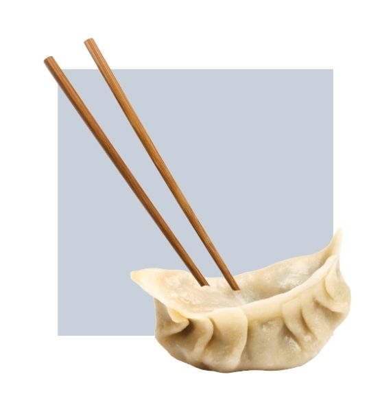 An image of a dumpling being picked up with chopsticks